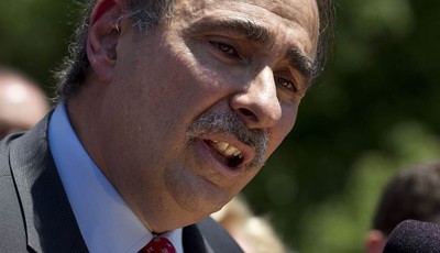 
              In this photo taken May 31, 2012, Obama adviser David Axelrod speaks to a crowd in front of the Statehouse, in Boston, where he criticized the gubernatorial record of Republican preside